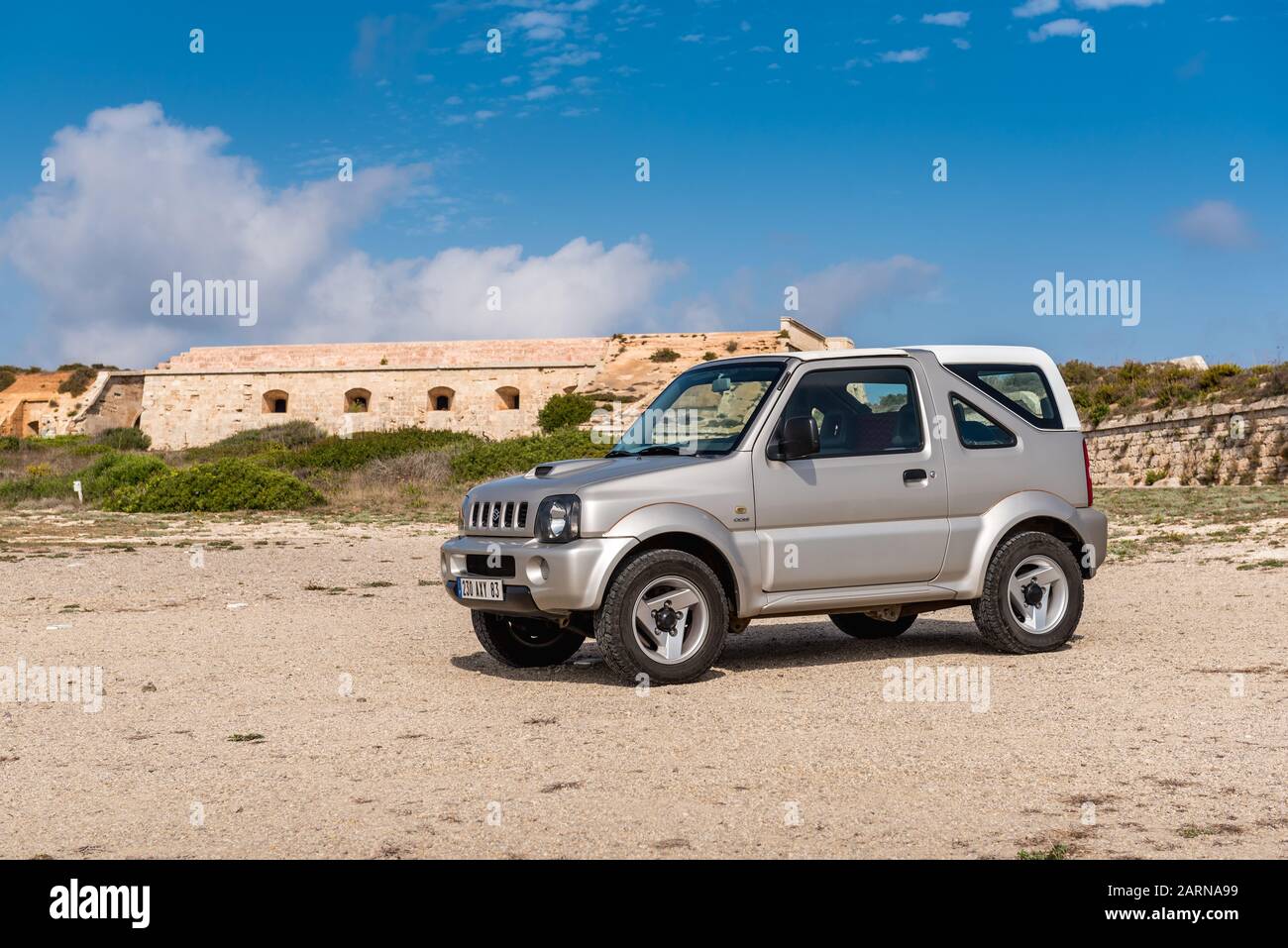 Mallorca, Spain - October 13, 2019: Suzuki Jimny 4x4 car parked on the coast of Menorca island. Stock Photo