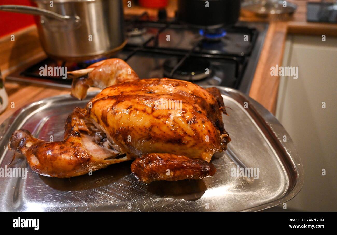 Roast chicken ready for carving for Sunday lunch Stock Photo Alamy