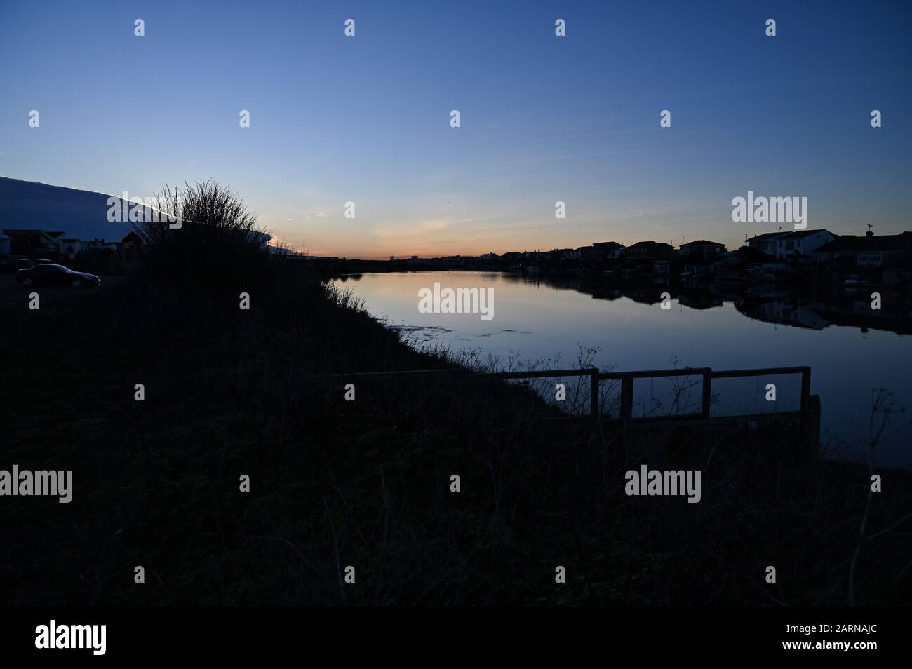 Widewater lagoon Lake in Lancing by Shoreham Beach at dusk Sussex UK is a haven for wildlife and