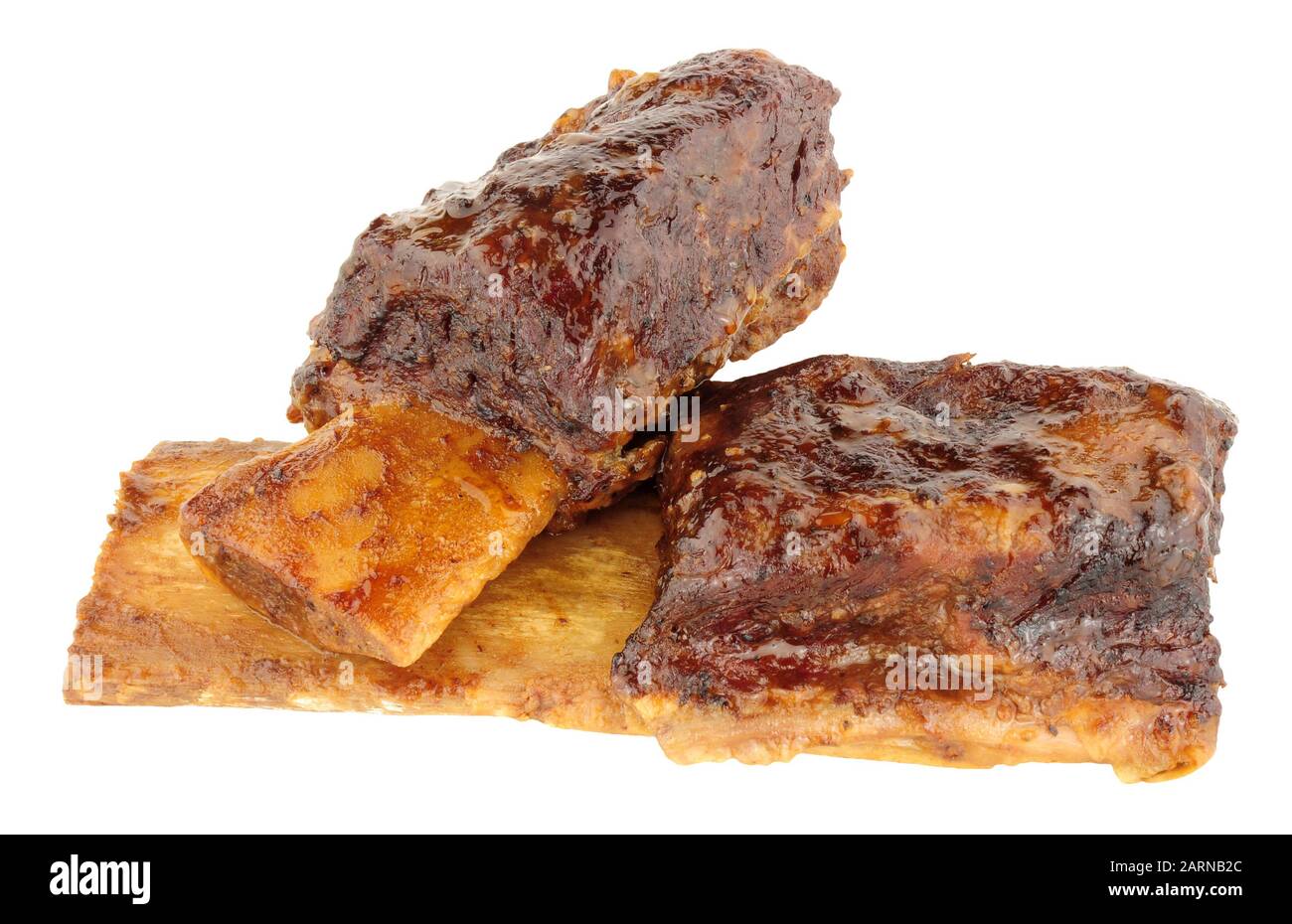 Two slow cooked beef short ribs isolated on a white background Stock Photo