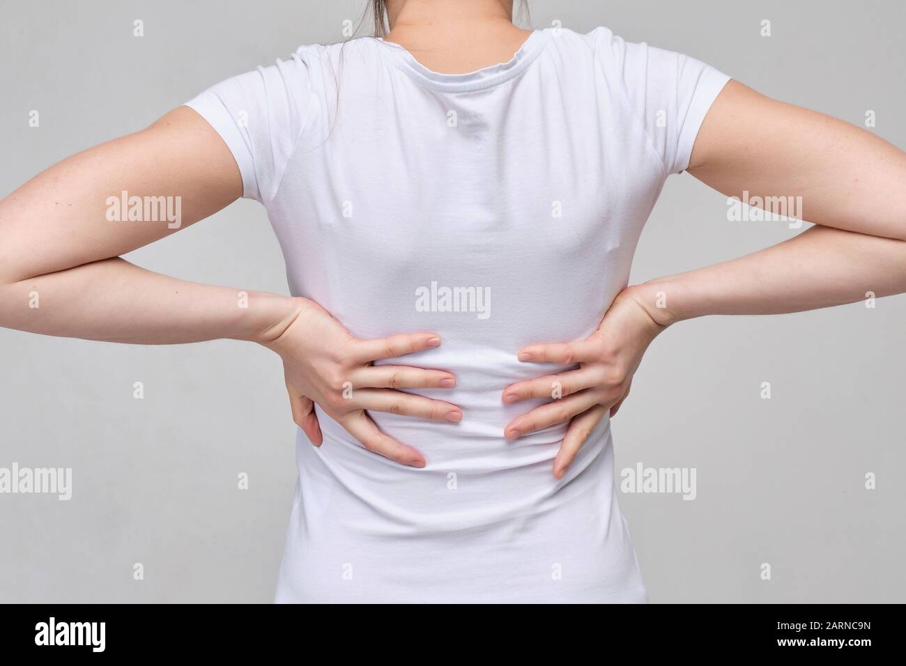 A Girl in a White T-shirt Massages the Groin. Gynecology Problems Stock  Photo - Image of background, girl: 172264378