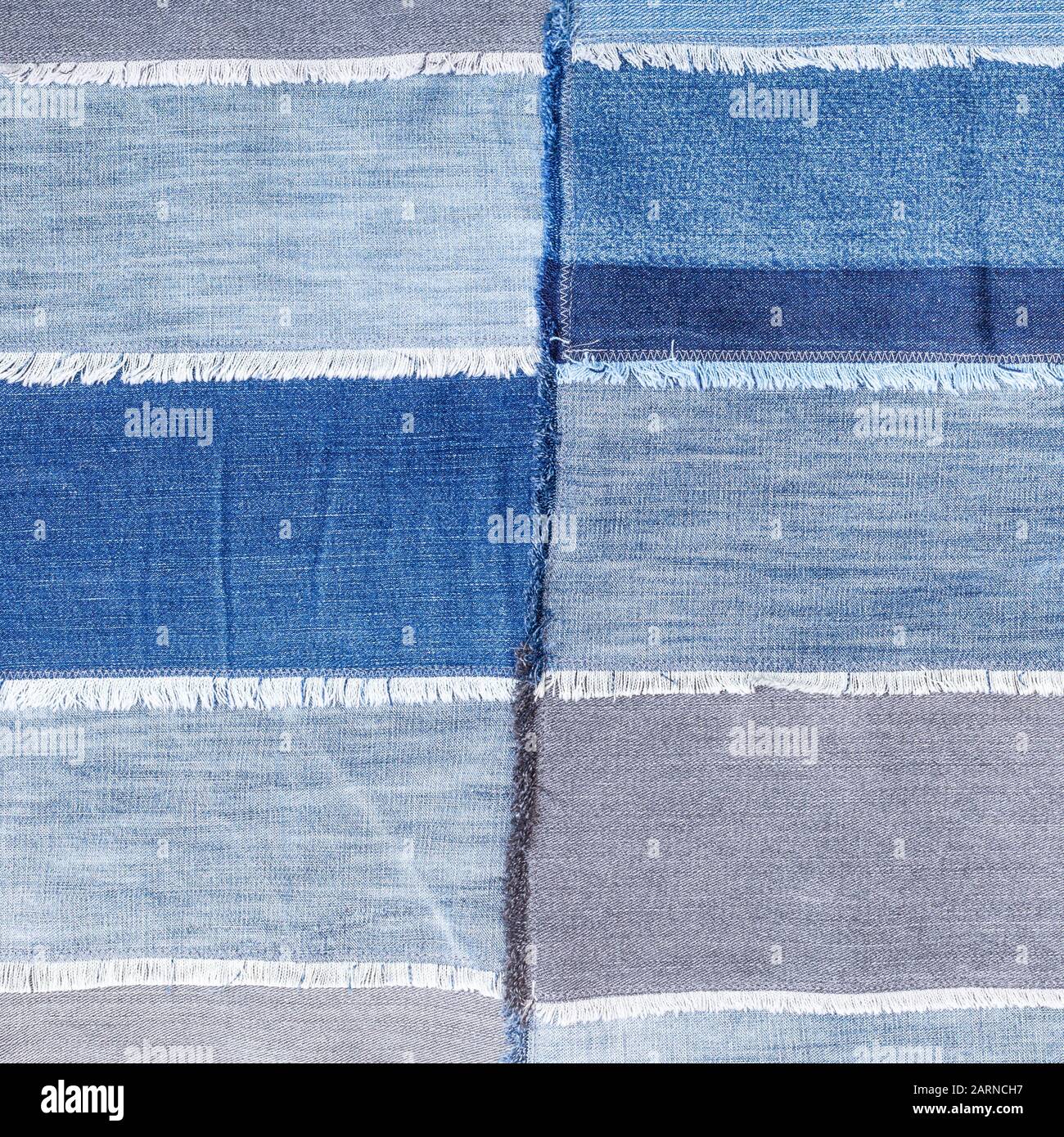 textile square background - patchwork from various denim flaps Stock Photo