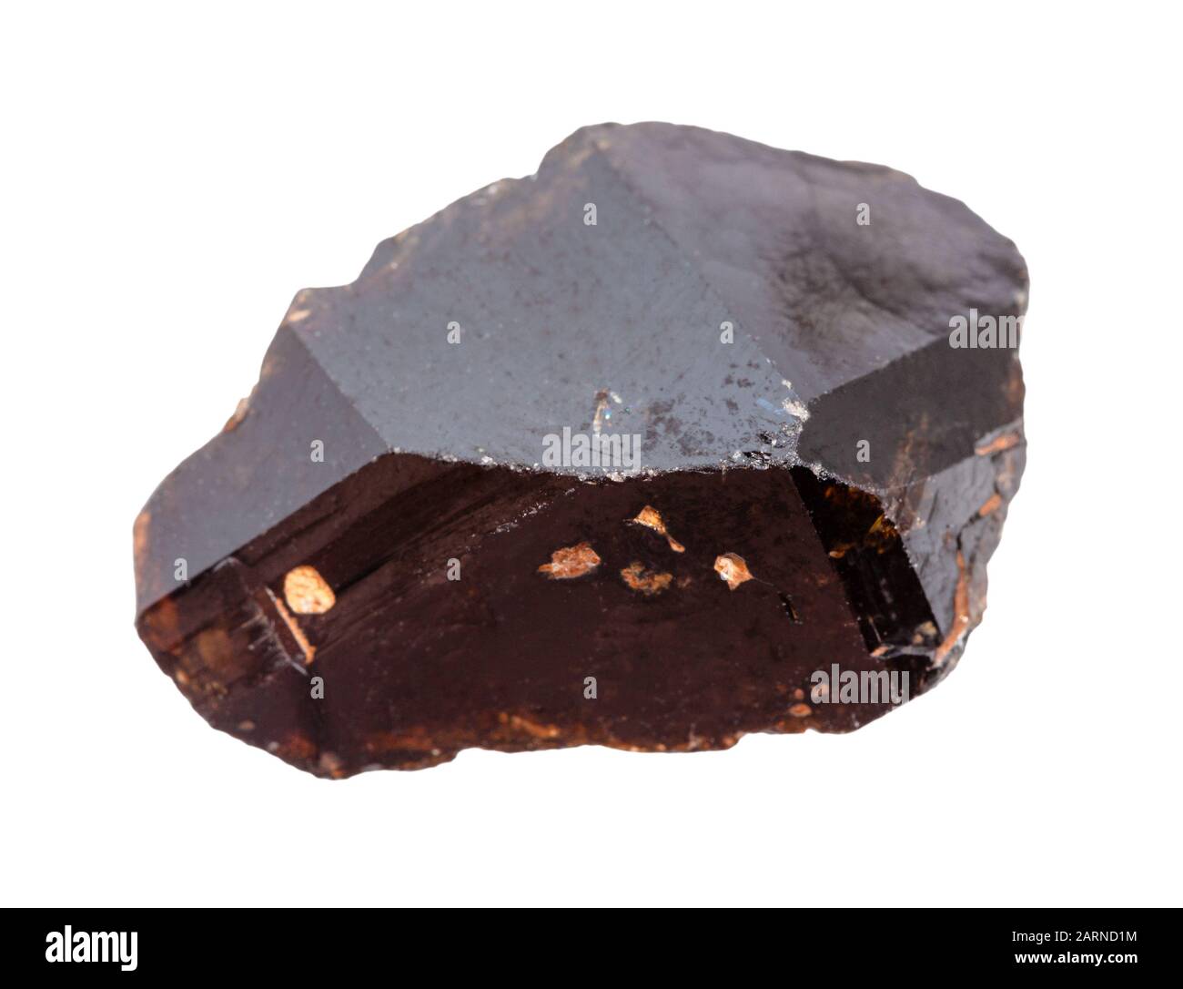 closeup of sample of natural mineral from geological collection - rough Cassiterite (tin ore ...