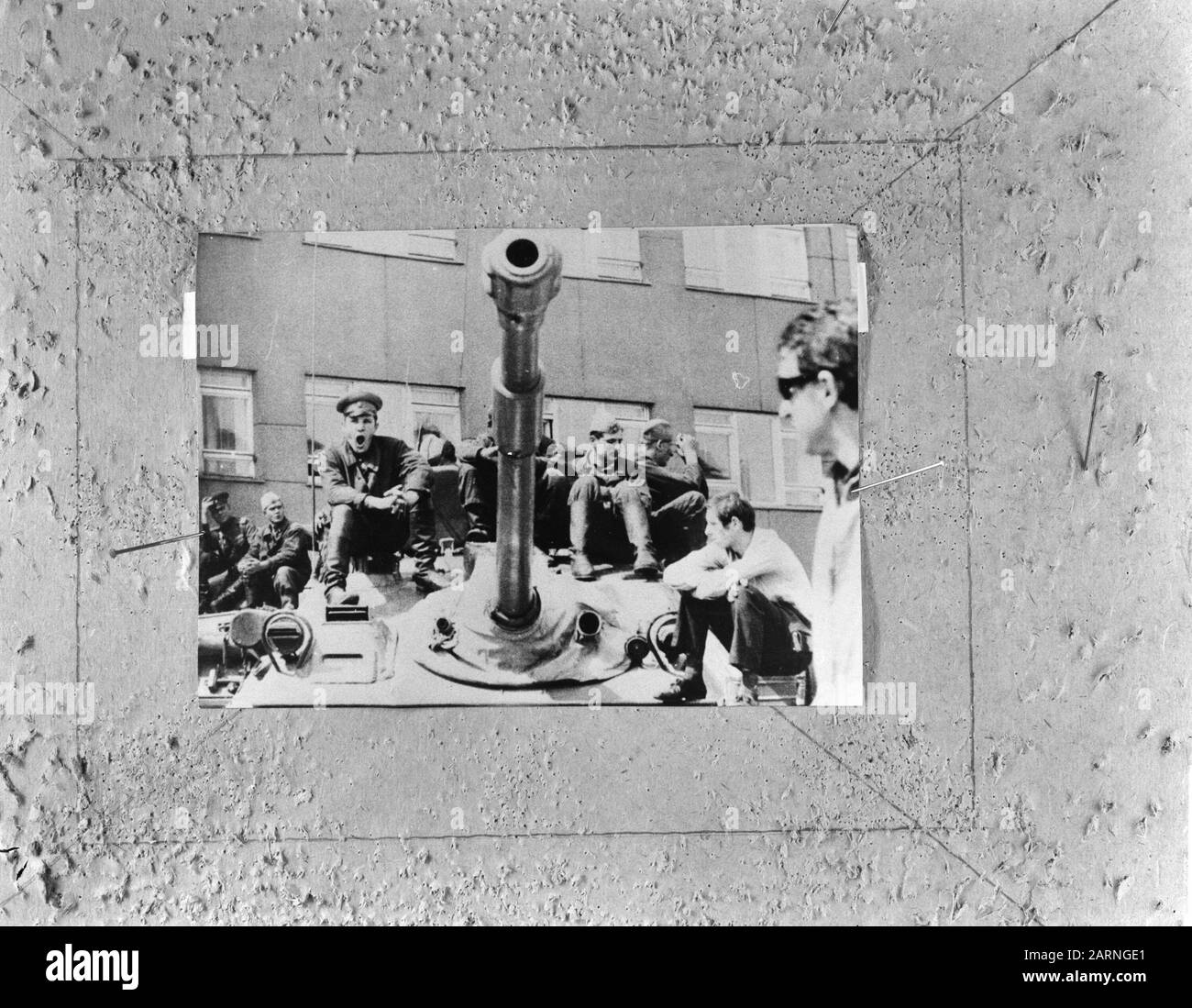 Armed Russian soldiers and civilians sitting on a tank in Prague Annotation: Repronegative Date: August 28, 1968 Location: Austria, Prague, Czech Republic, Czechoslovakia Keywords: soldiers , tanks Stock Photo