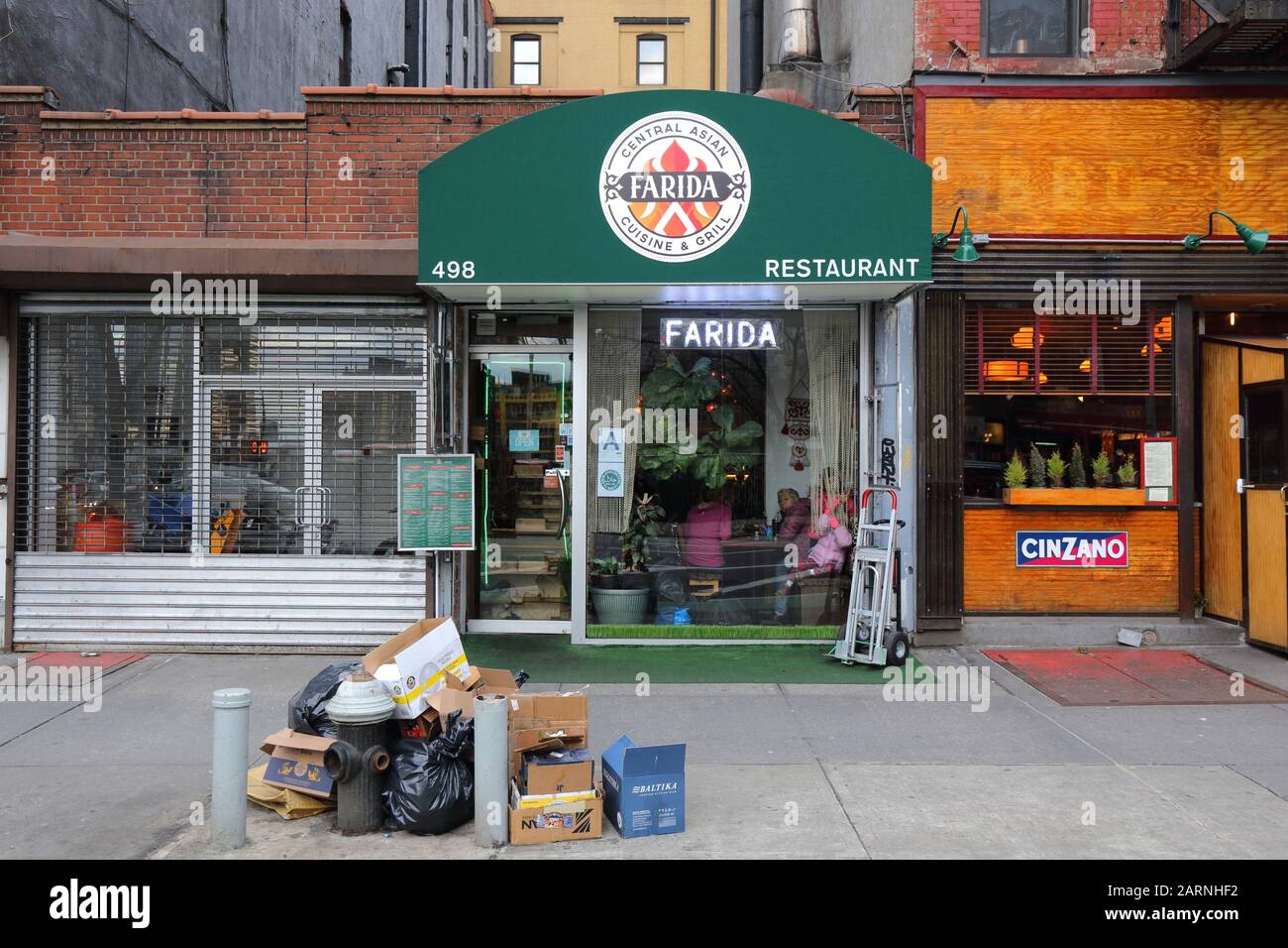 Farida, 498 9th Avenue, New York, NYC storefront photo of a halal Uzbeki restaurant in the Hell's Kitchen neighborhood of Manhattan. Stock Photo