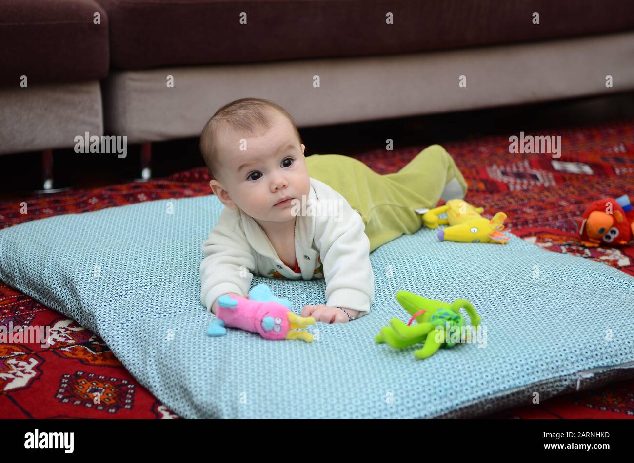 a cute toddler in pyjamas in the morning at home. Stock Photo