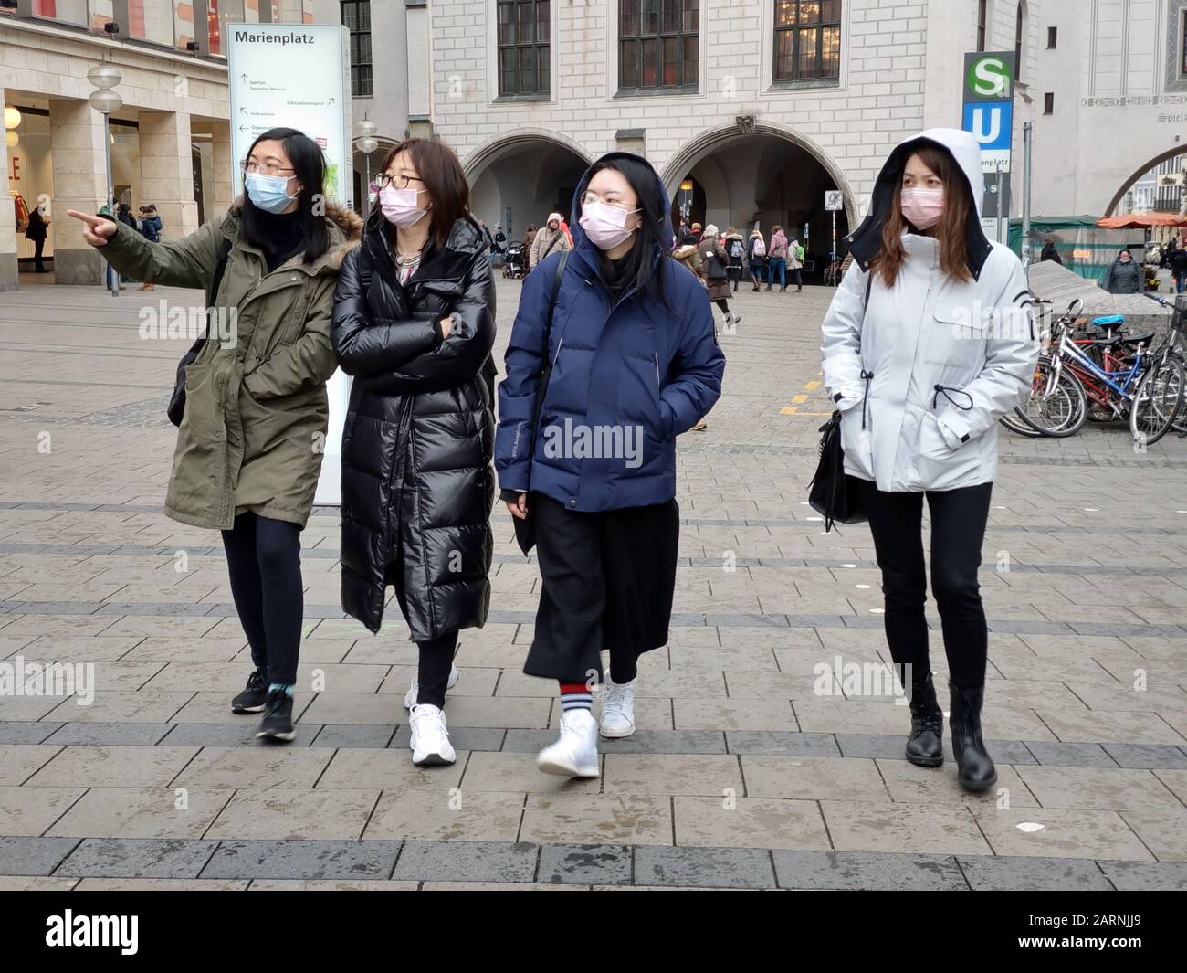 Munich, Bavaria, Germany. 29th Jan, 2020. Four women are among the increasing number of tourists and residents of the city of Munich, Germany wearing breathing masks on the streets in response to Germany's first case of Corona Birus in nearby Starnberg. The affected was infected by a Chinese coworker visiting from Shanghai and is currently at Klinikum Schwabing in Munich. Credit: Sachelle Babbar/ZUMA Wire/Alamy Live News Stock Photo
