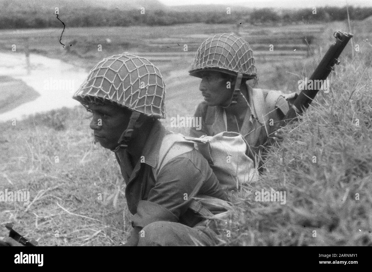 Action of the V-Brigade, Gadja Merah [the Red Elephant] in Bekal and surroundings  [Two KNIL soldiers in cover near the edge of a kali] Date: 30 March 1949 Location: Bekal, Indonesia, Dutch East Indies Stock Photo