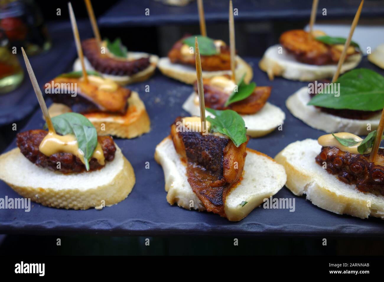 Small Octopus Appetizer/Snack 'Spanish Tapas' on Sliced White Bread in