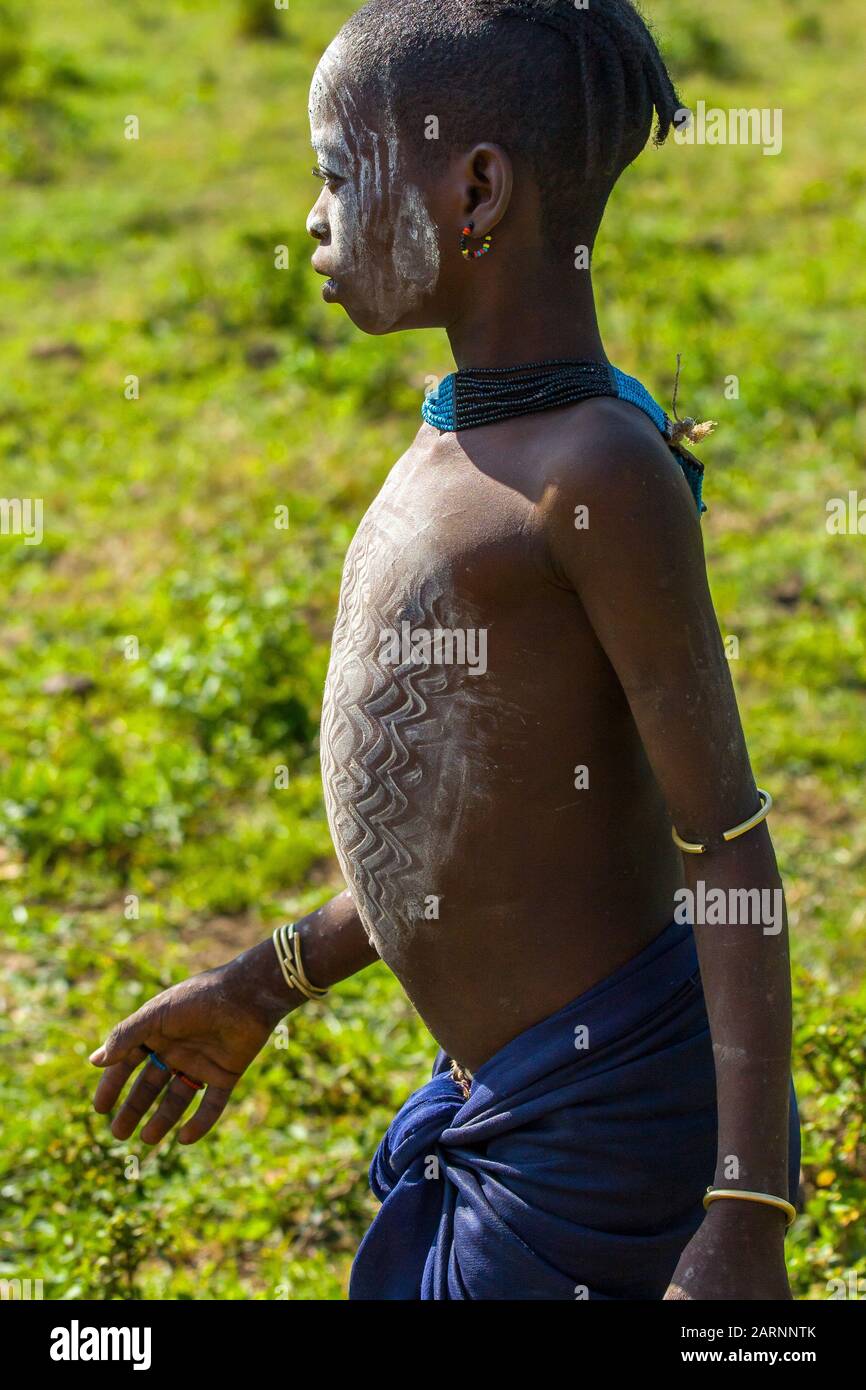 Portrait Of Young Hamer Tribe Boy With Necklaces And Impressive Body portrait-of-young-hamer-tribe-boy-with-necklaces-and-impressive-body