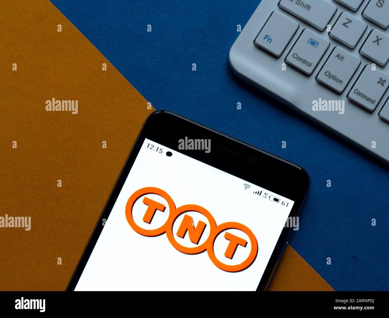 In this photo illustration the TNT Express logo is seen displayed on a smartphone Stock Photo