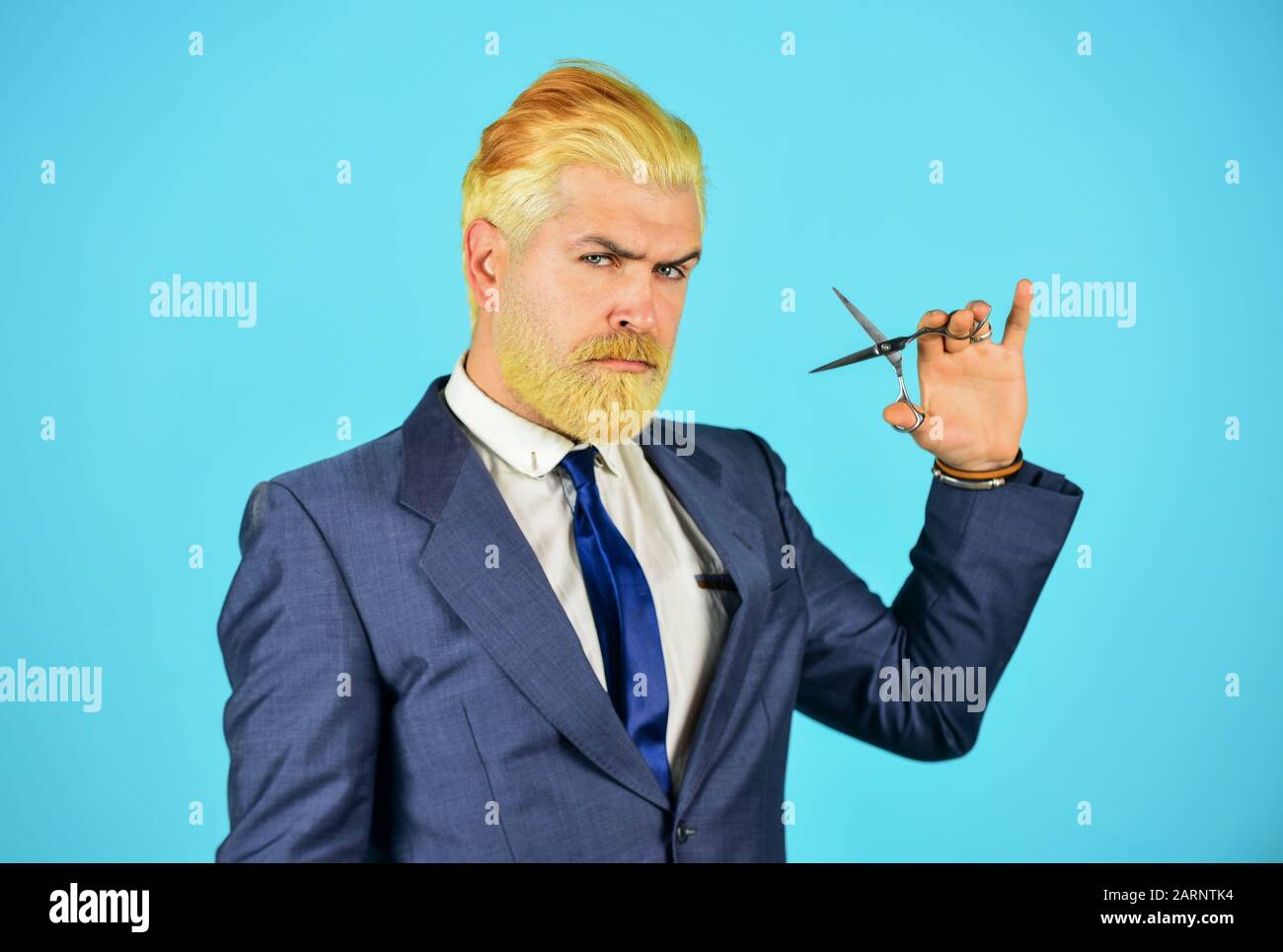 Personal stylist barber. Bearded man hold razor scissors. Retro