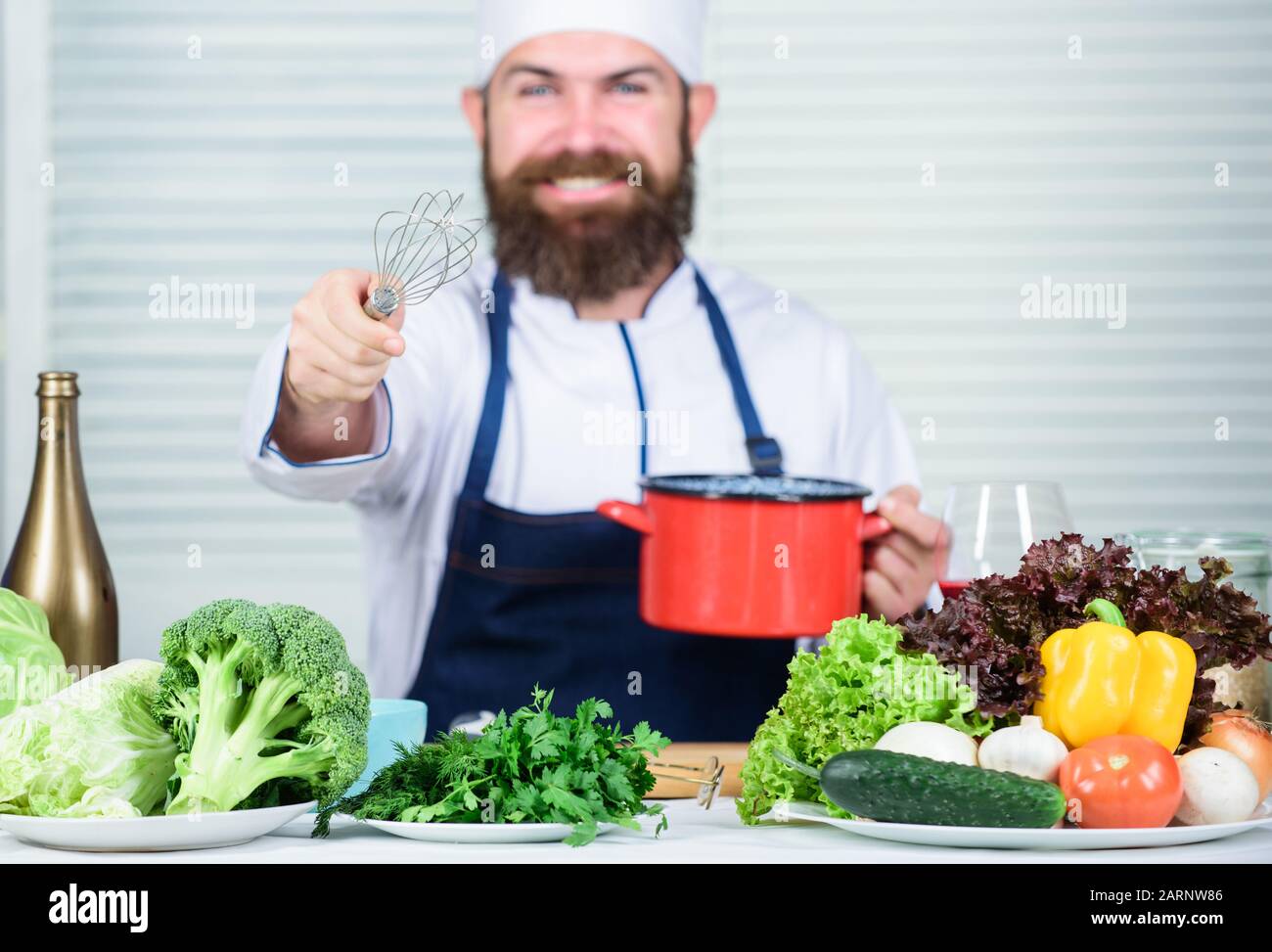 Use hand whisk. Professional chef hold whisk and pot. Whipping like pro