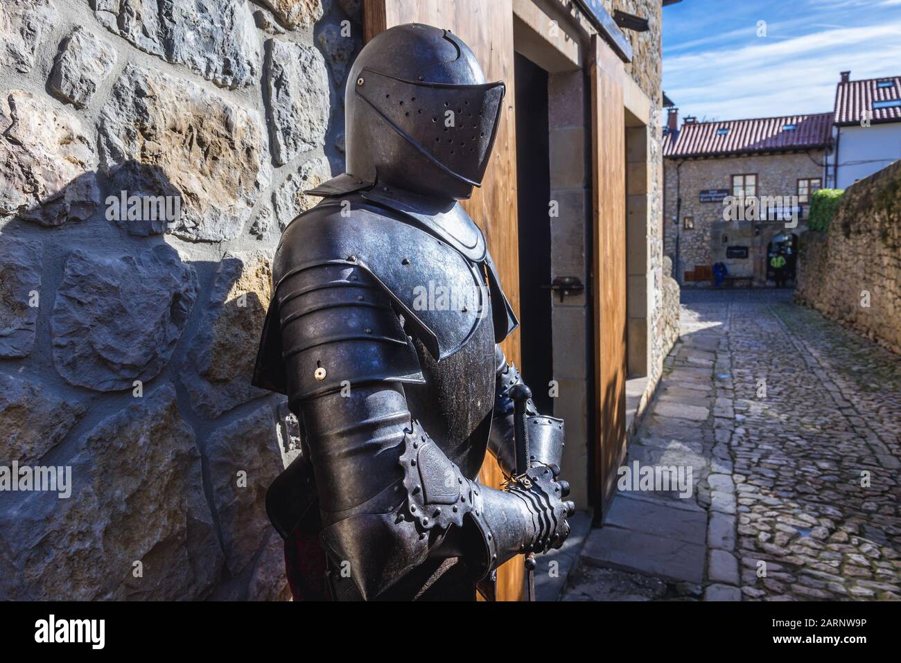 Knighty armour in front of Museum of Torture - Inquisicion in Santillana del Mar historic town located in Cantabria autonomous community of Spain Stock Photo