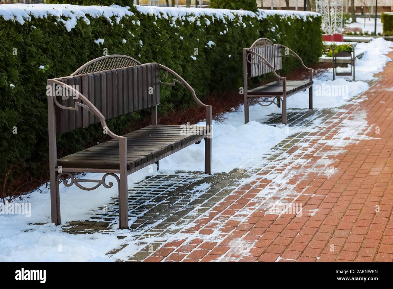 Snow covered alley benches hi-res stock photography and images - Alamy