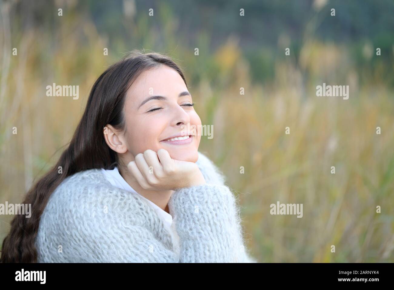 Candid happy teenage girl enjoying nature breathing fresh air Stock Photo