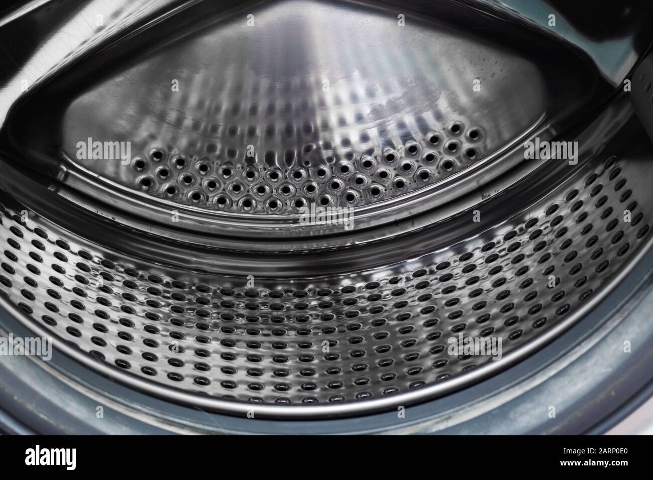 The washing machine drum inside close up Stock Photo