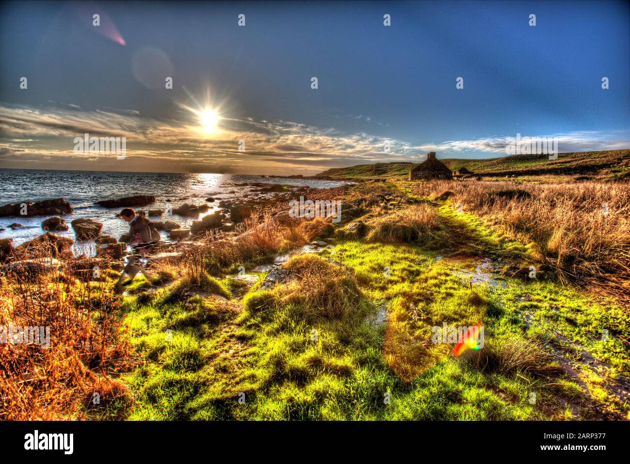 Fife Coastal Path, Scotland. Artistic silhouetted view of the Fife Coastal Path, between the villages of Anstruther and Crail. Stock Photo