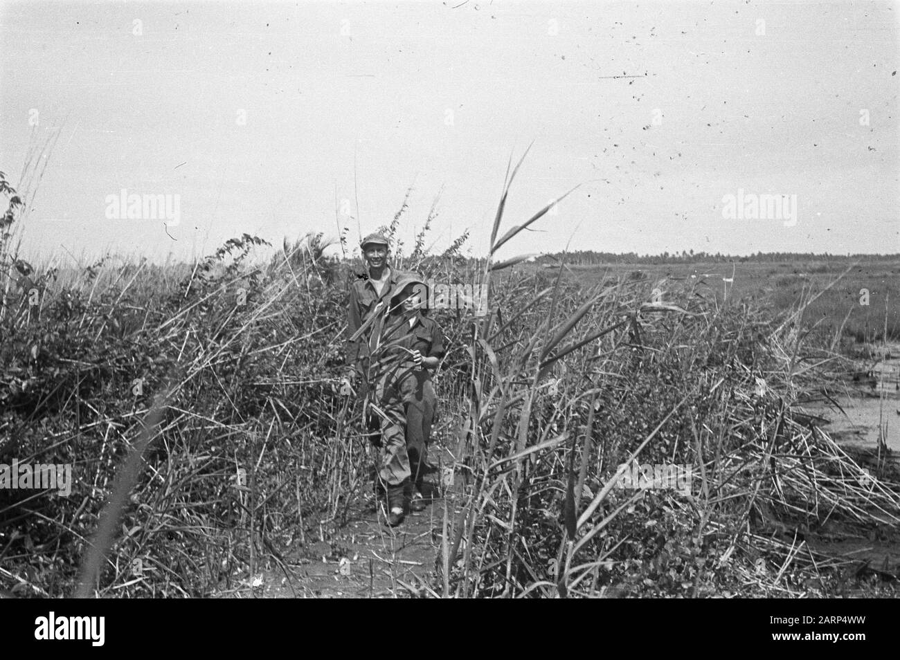 In traditional attire holds Black and White Stock Photos & Images - Alamy