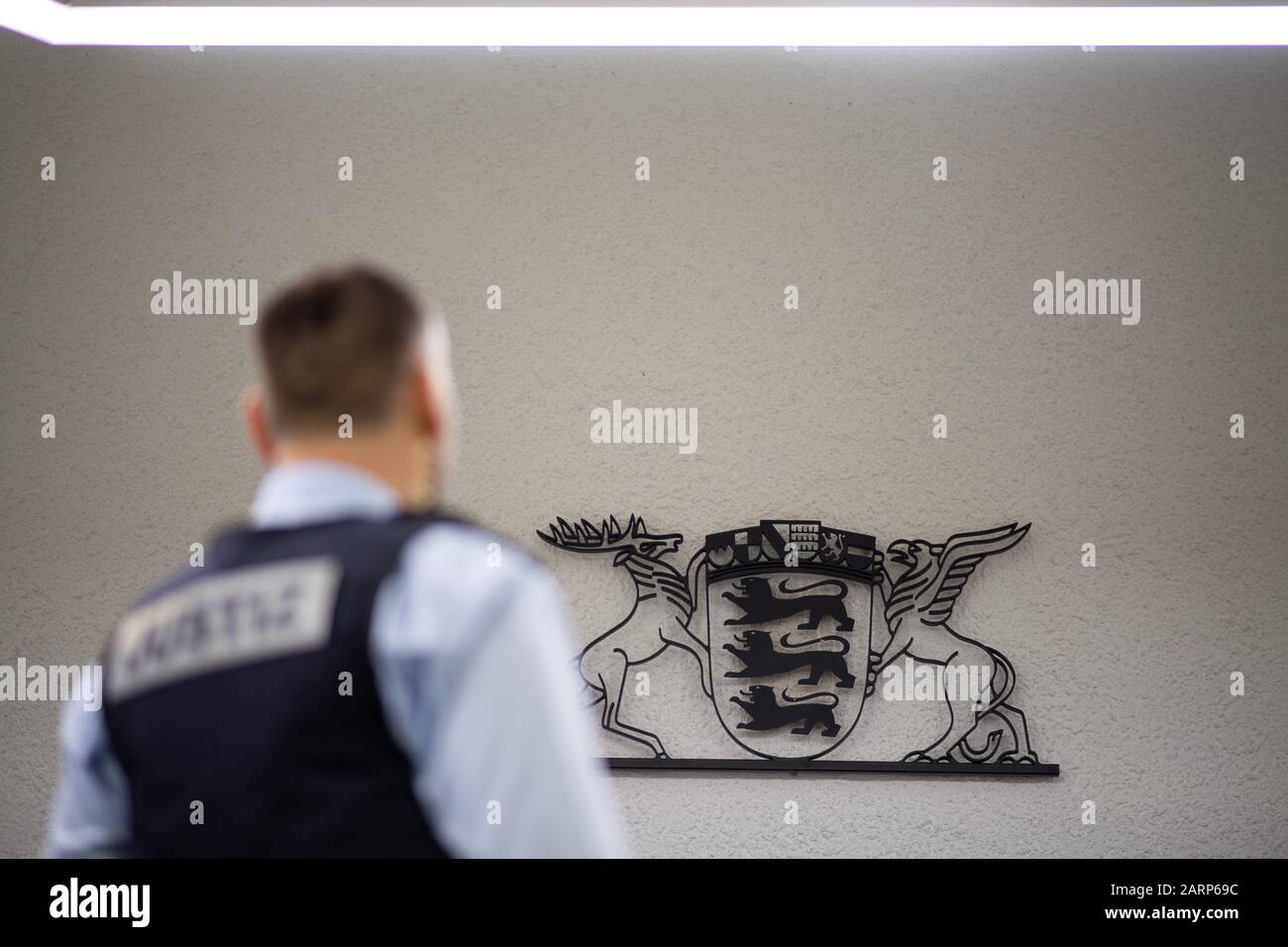 Stuttgart, Germany. 28th Jan, 2020. A judicial officer stands in a