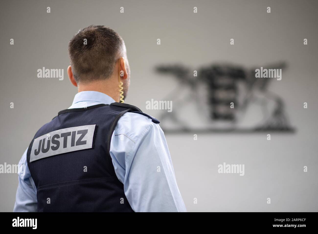 Stuttgart, Germany. 28th Jan, 2020. A judicial officer stands in a