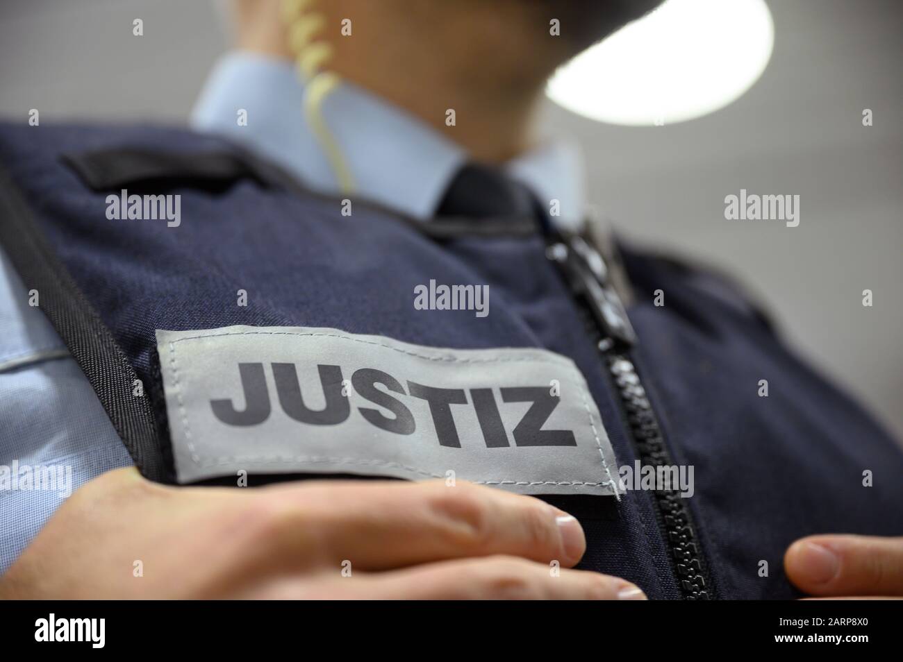Stuttgart, Germany. 28th Jan, 2020. A judicial officer stands in a