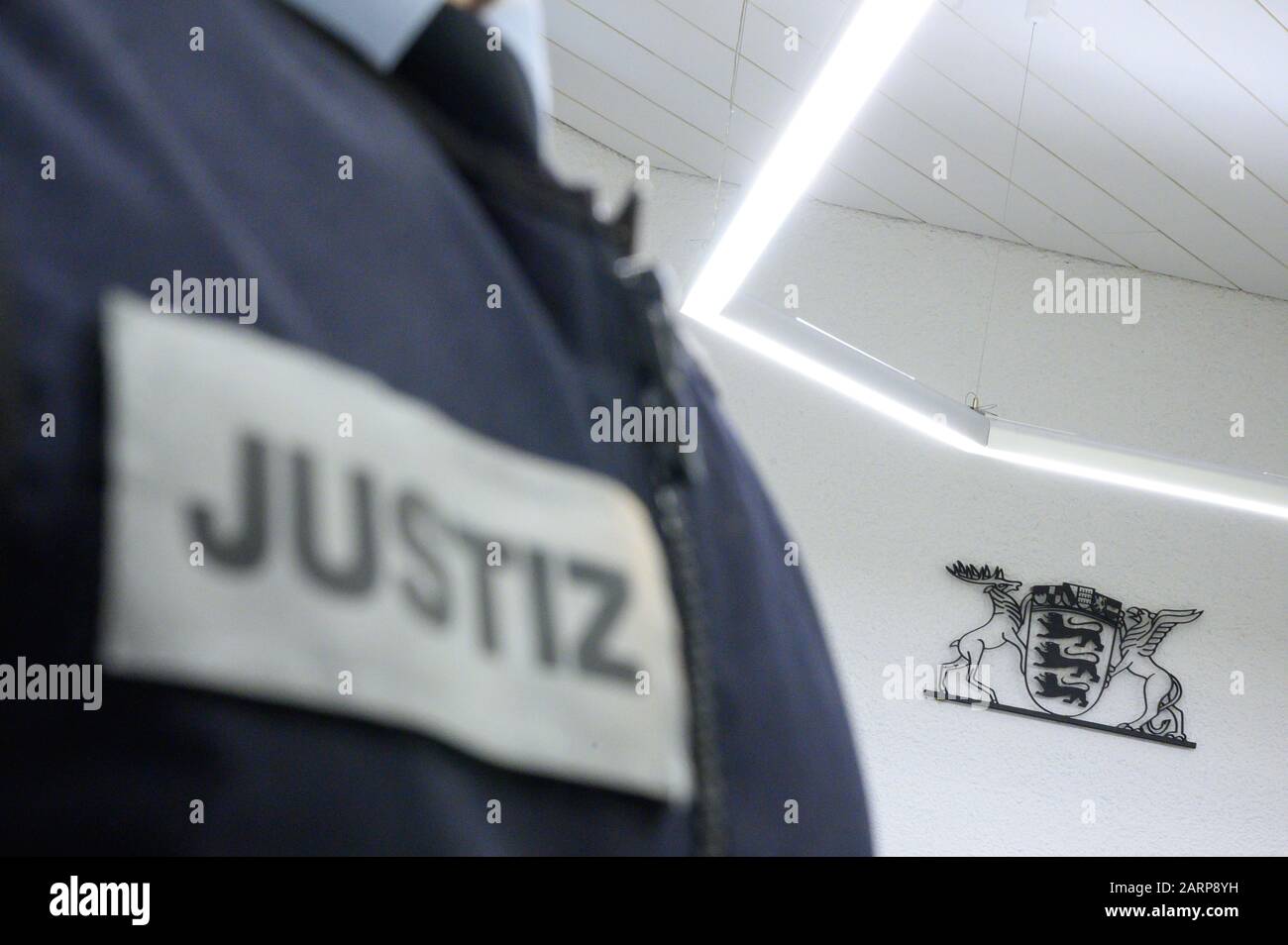 Stuttgart, Germany. 28th Jan, 2020. A judicial officer stands in a