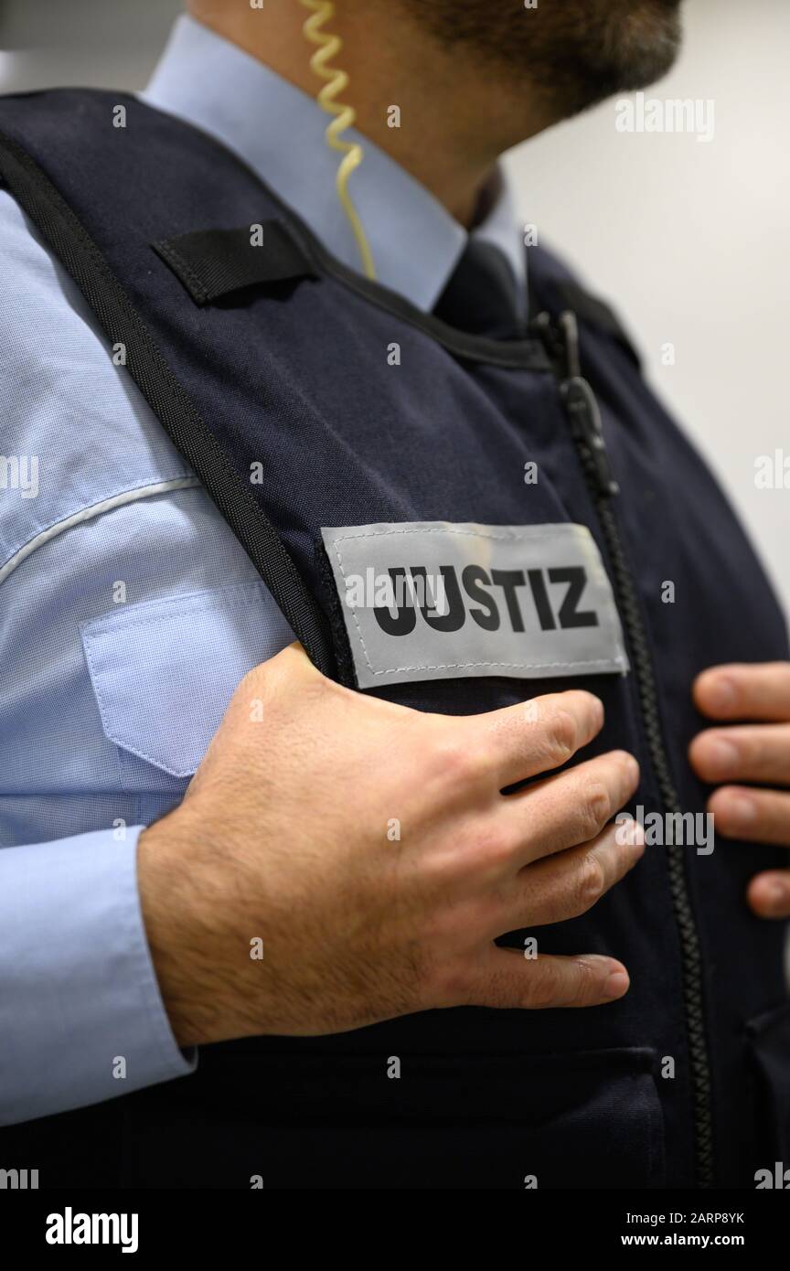 Stuttgart, Germany. 28th Jan, 2020. A judicial officer stands in a