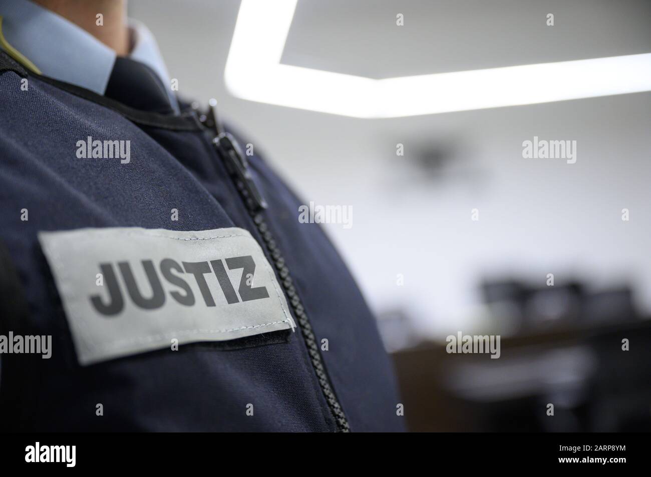 Stuttgart, Germany. 28th Jan, 2020. A judicial officer stands in a
