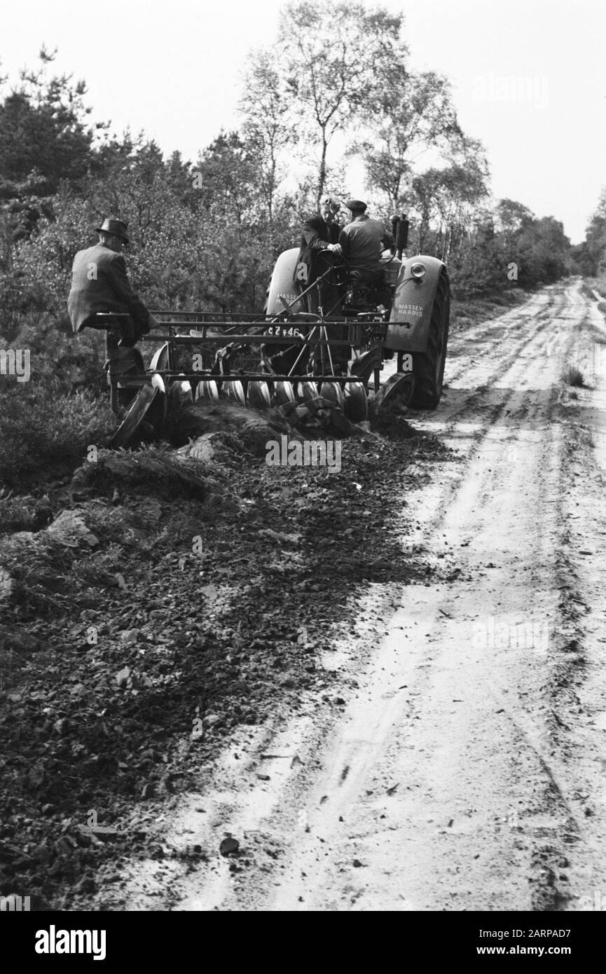 [Eg behind a tractor driving a country road] Date undated Location De
