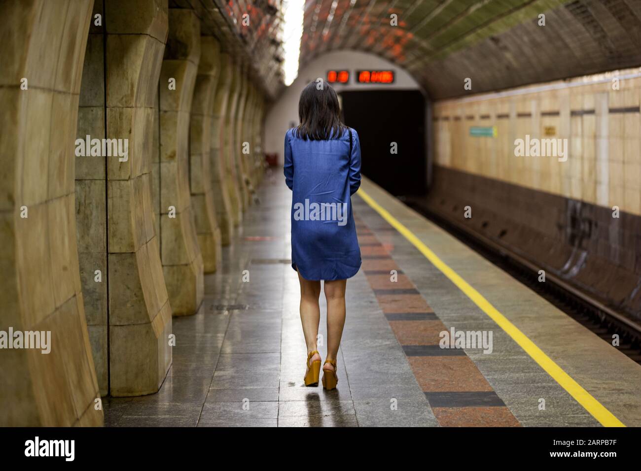 sad girl goes to the subway dungeon Stock Photo