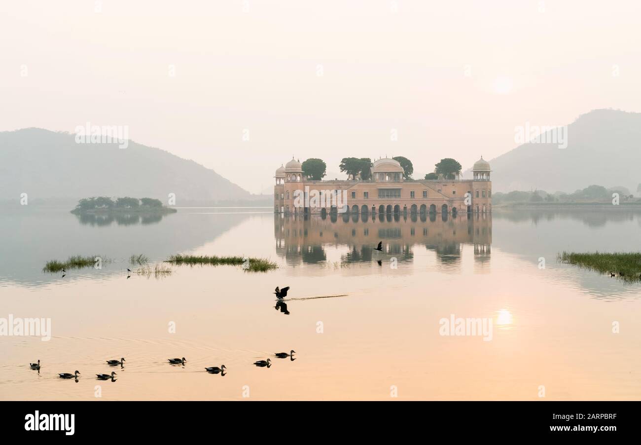 Empty Royal palace surrounded by lake and Aravalli hills as backdrop at sunrise in Jaipur, Rajasthan, India. Stock Photo