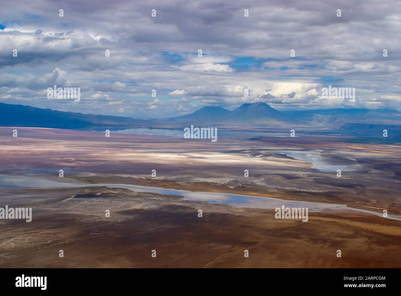 Mount Keremasi and the volcano Oldoinyo Lengai (aerial view from Lake Natron, Tanzania) Stock Photo