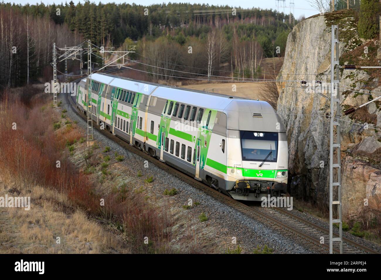 Modern VR Group electric 2 storey passenger train at speed in winter
