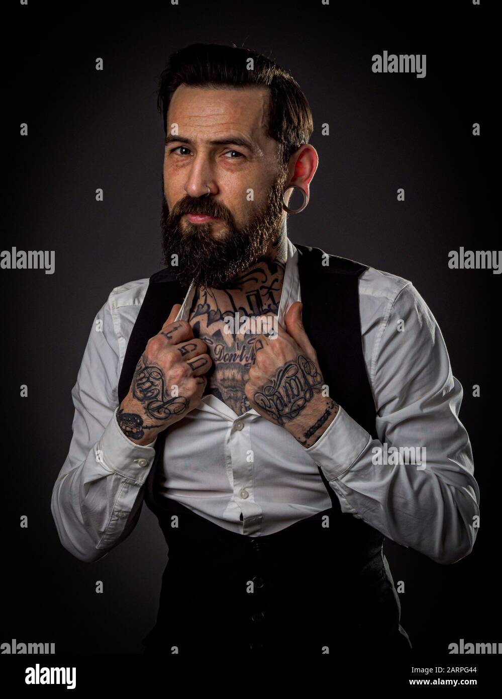 Studio Portrait of a male model with beard and tattoos Stock Photo