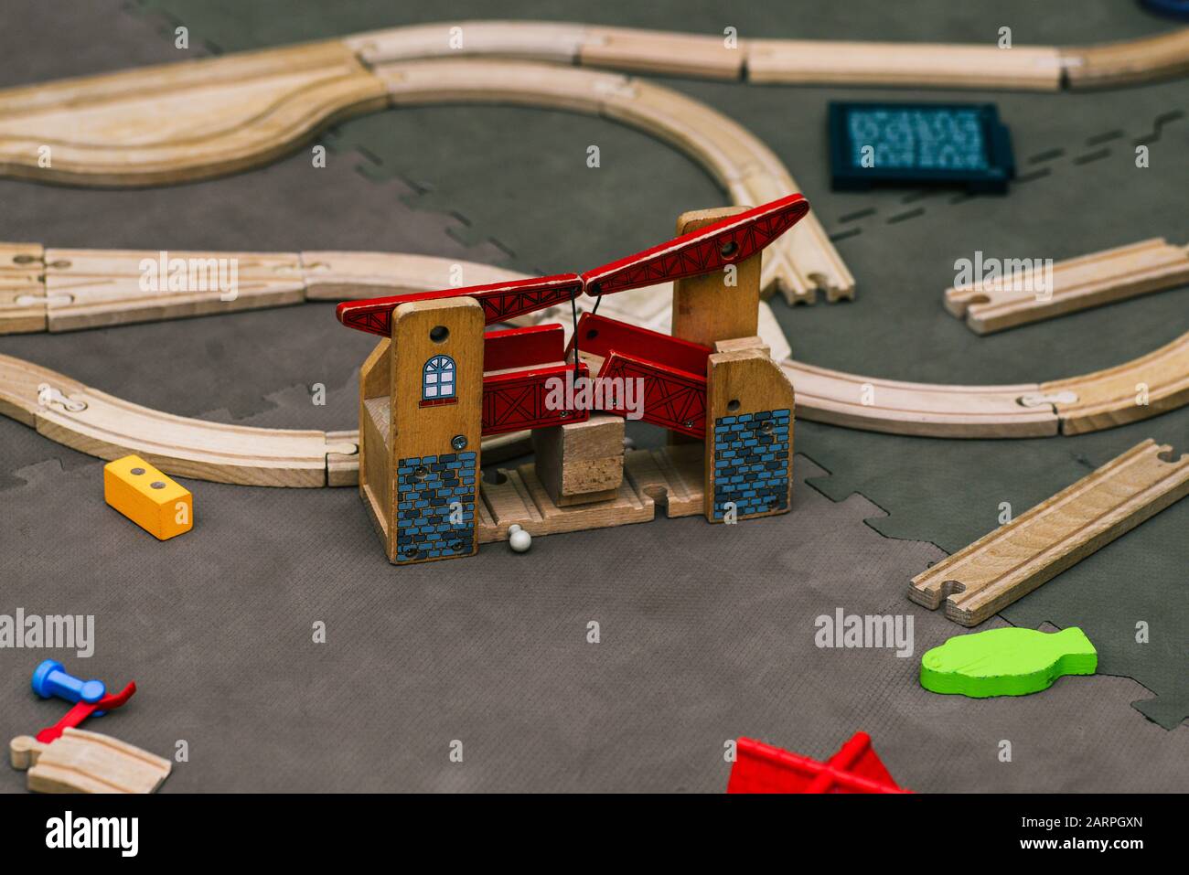 Details of a wooden constructor. Architectural constructions in miniature. Wooden railway. Stock Photo