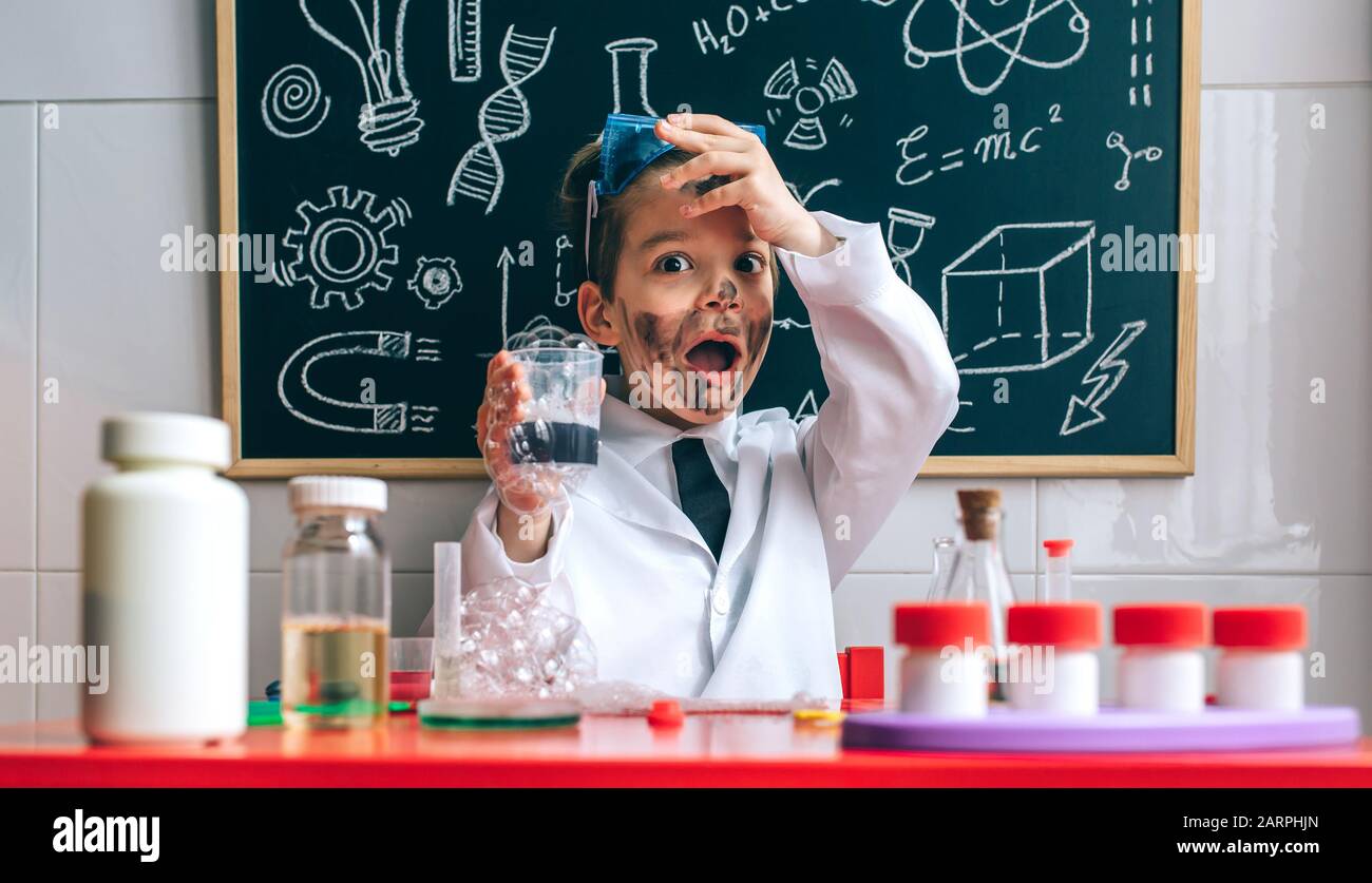Funny boy chemist with dirty face Stock Photo