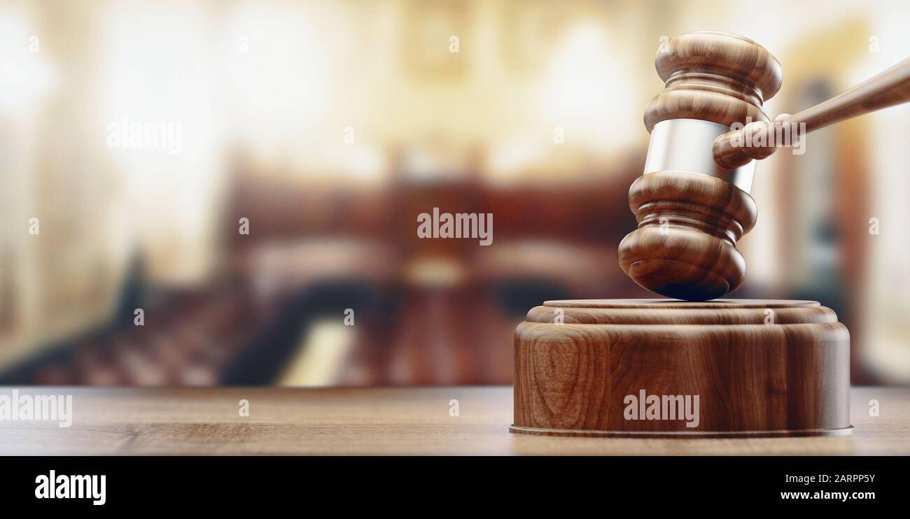 Law theme, mallet of the judge, wooden desk, scales of justice, books. 3d rendering Stock Photo