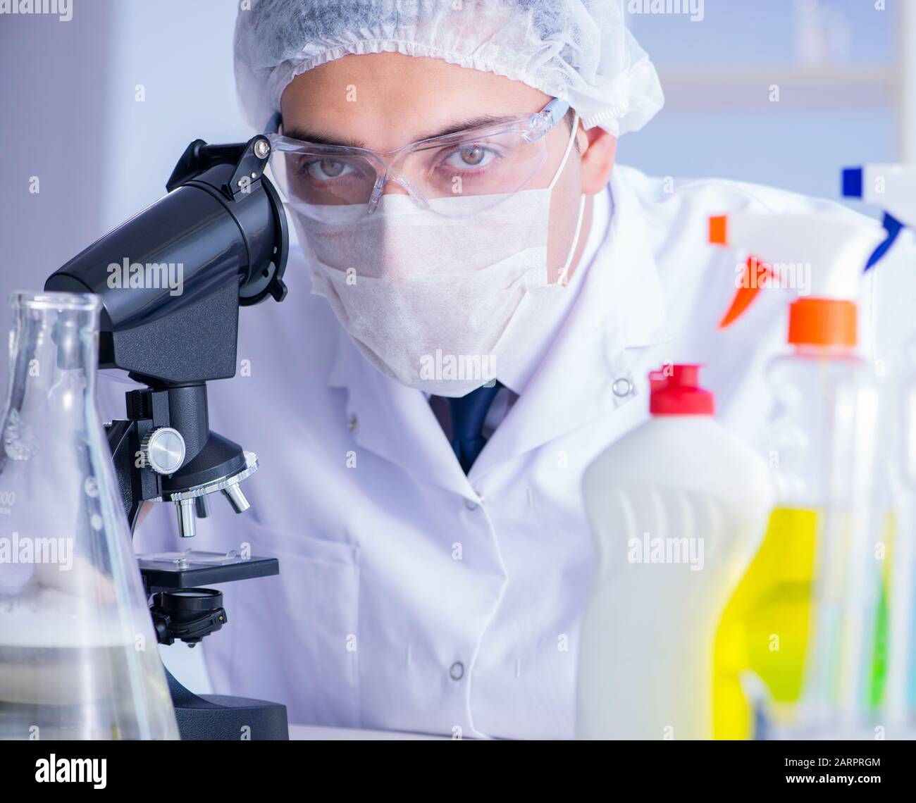 The man in the lab testing new cleaning solution detergent Stock Photo