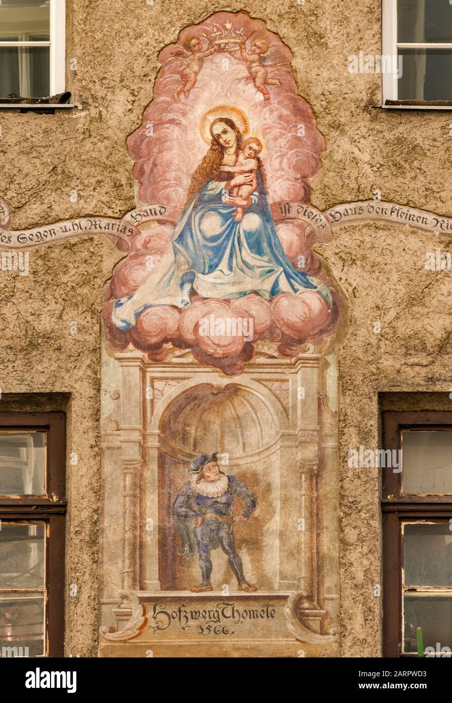Virgin Mary with Jesus and court dwarf Thomele mural, dated 1566, on building at Stiftgasse, Old Town in Innsbruck, Tyrol, Austria Stock Photo