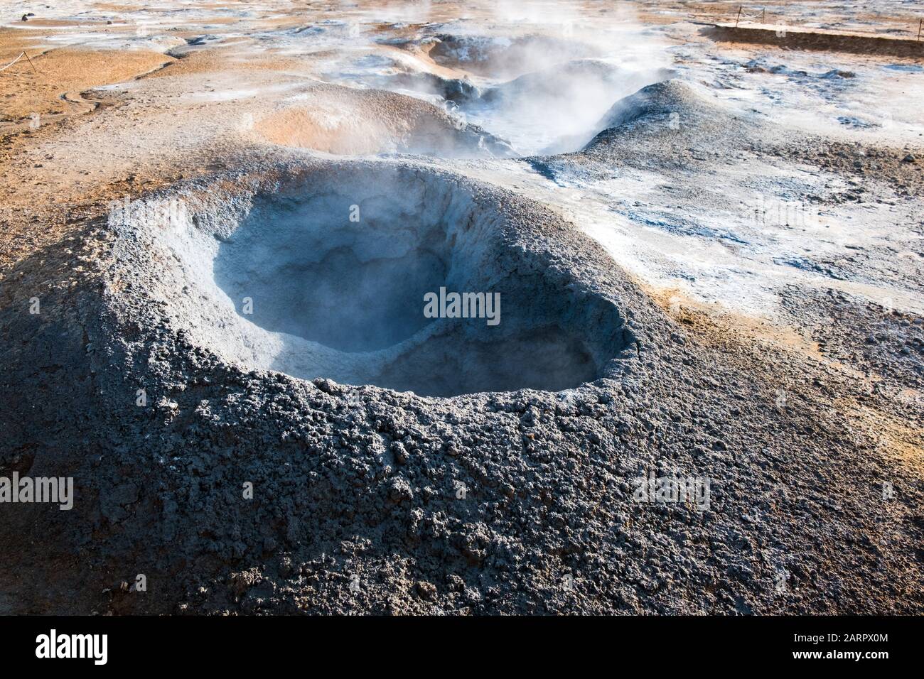 Hverir, also known as the Namafjall Geothermal Area, is located near Northeast Iceland and contains smoking fumaroles such as this one Stock Photo