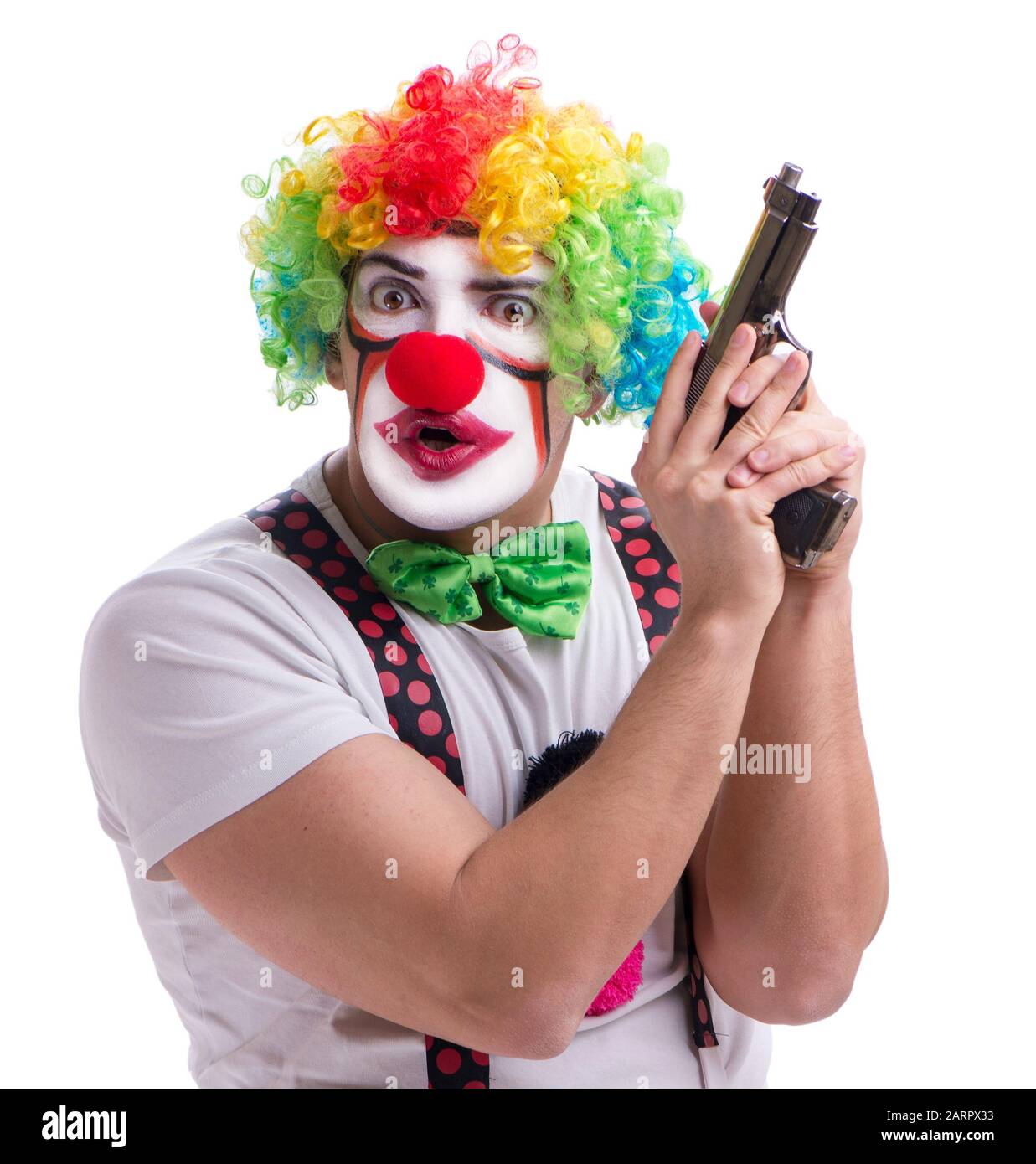 The funny clown with a gun pistol isolated on white background Stock