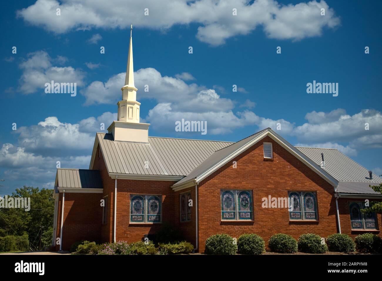 Brick Church with Stained Glass Stock Photo