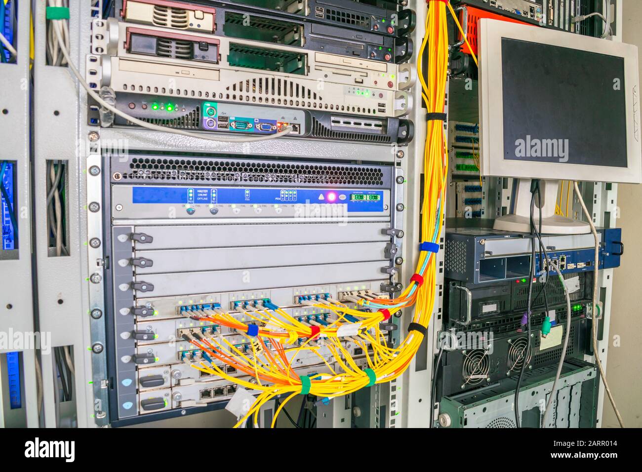 Rack with powerful Internet servers. The monitor is installed in a computer  cabinet. A central router with multiple optical cables is located in the d  Stock Photo - Alamy