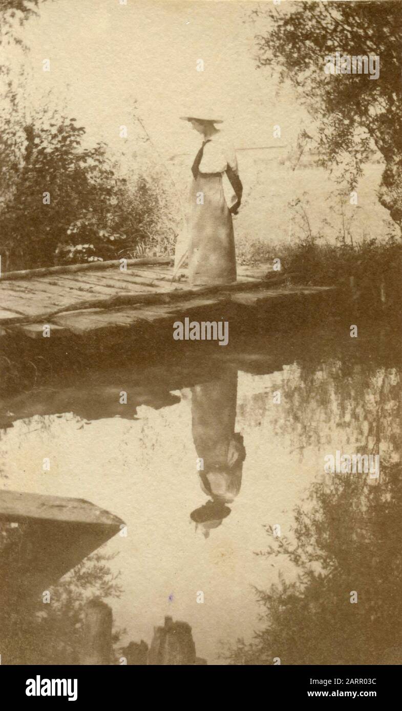 Woman reflexed in a body of water, Italy 1914 Stock Photo