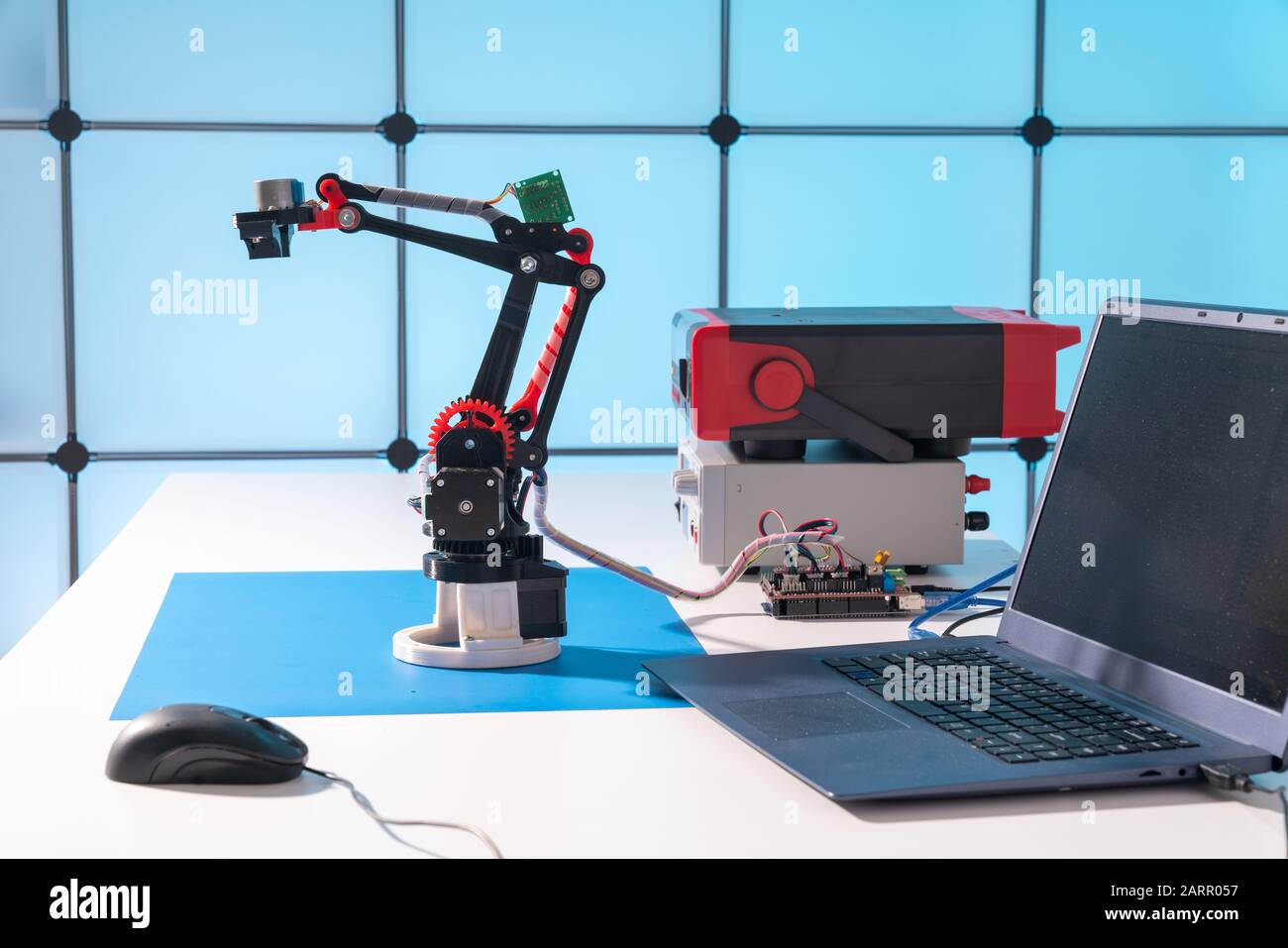 Model of a robot and a laptop on a table in a design office Stock Photo ...