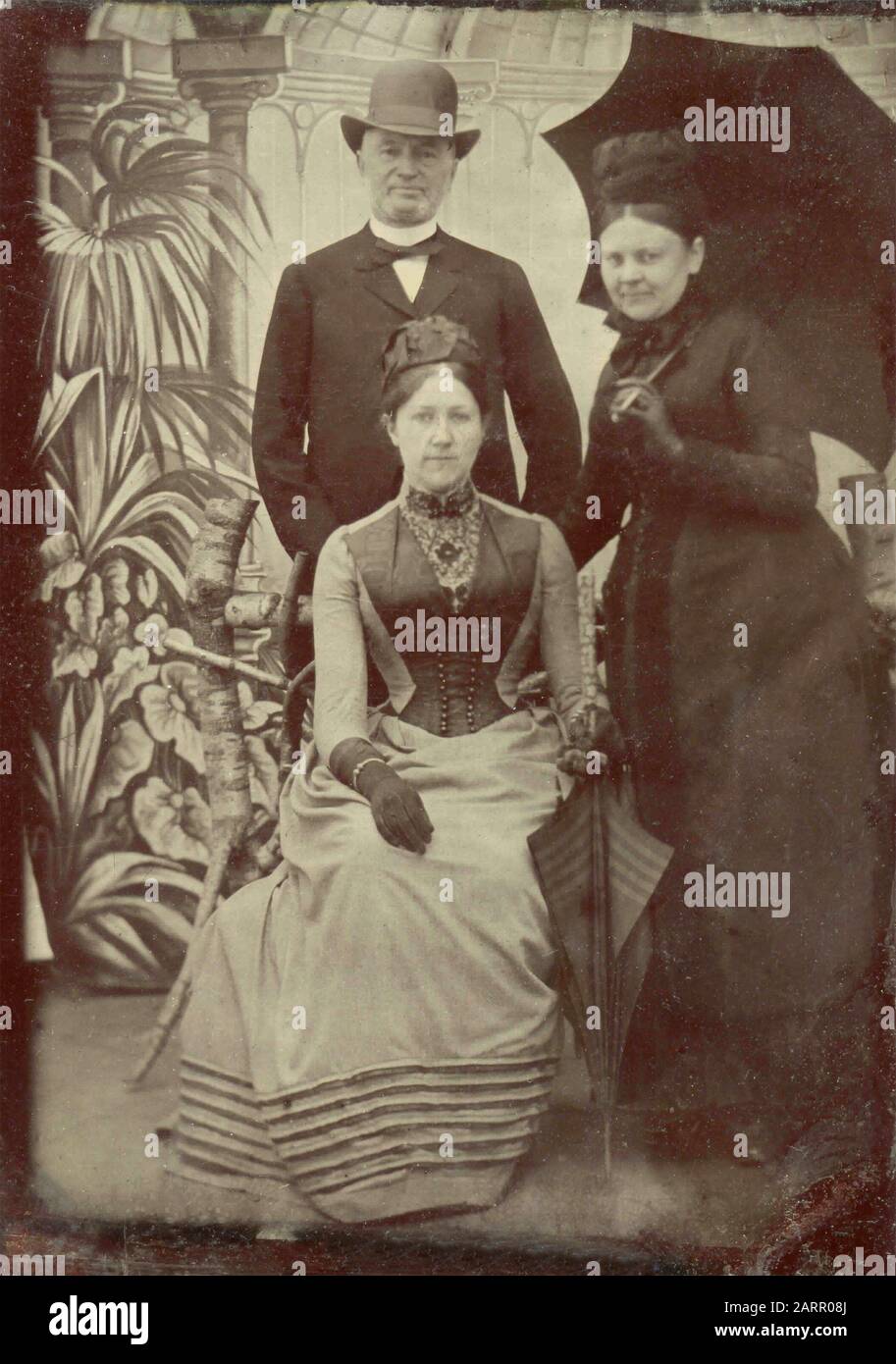 Portrait of a small family, ferrotype 1870s Stock Photo