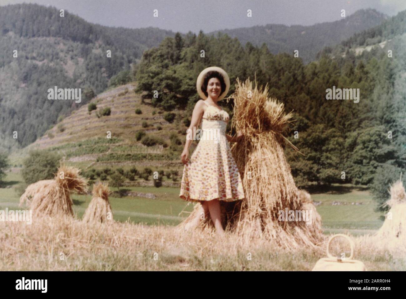 Woman in a wheat field with a bundle, Italy 1944 Stock Photo