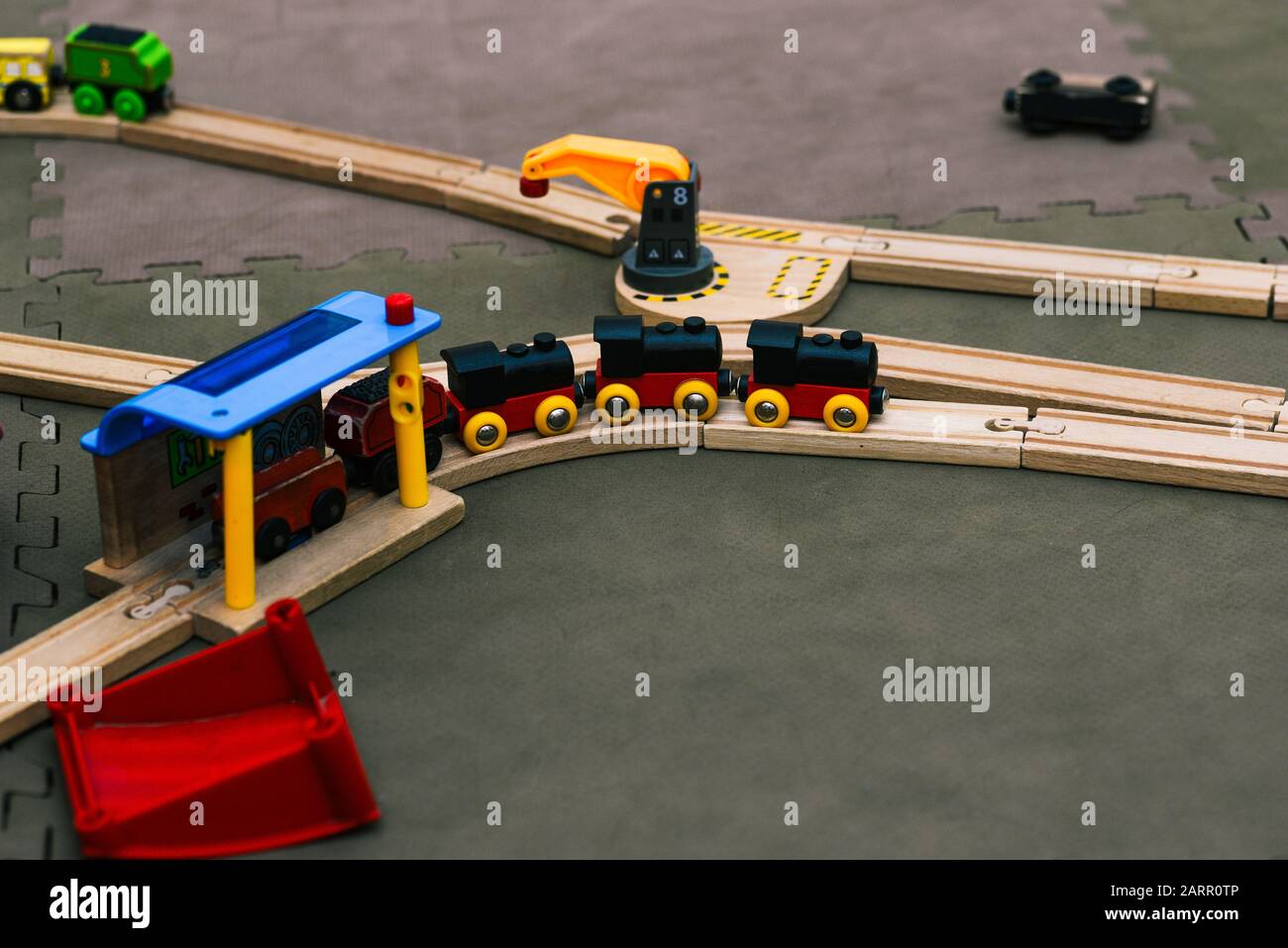 Toys Train With Rails Toy railway. A wooden train with wagons rides on rails. Ecological toys ...