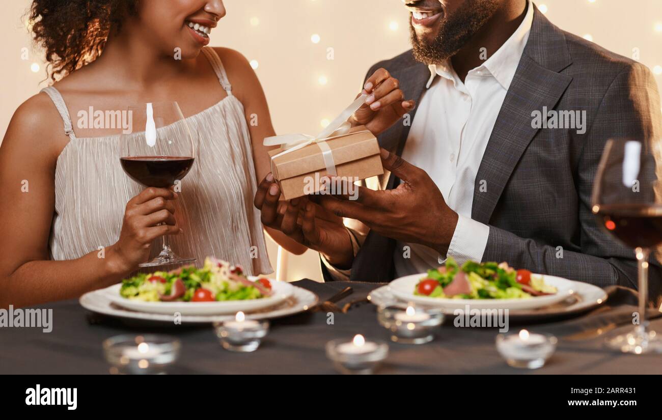 Man in love giving valentine's present to his girlfriend Stock Photo